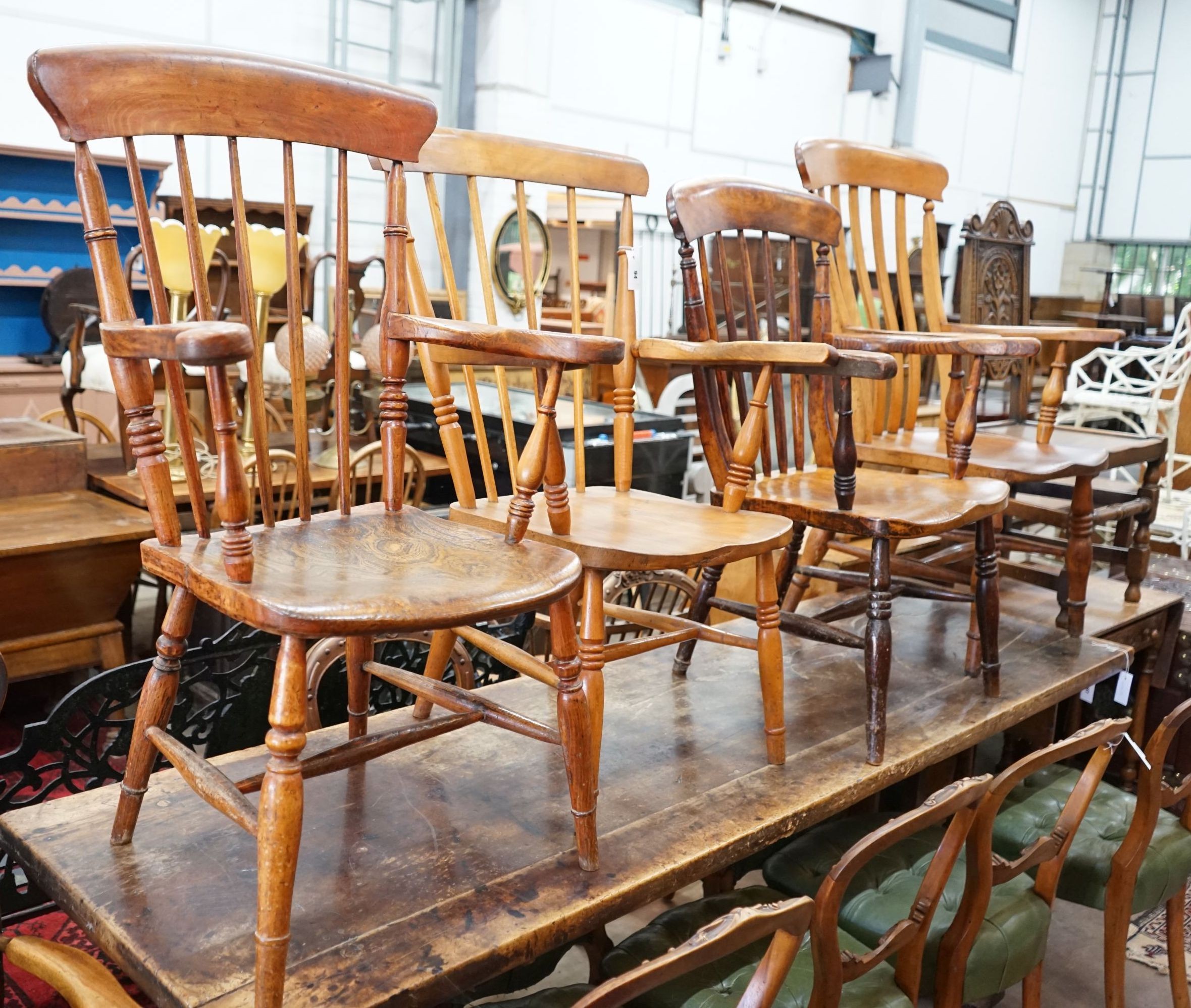 Five Victorian elm, ash and beech Windsor lathe and comb back elbow chairs